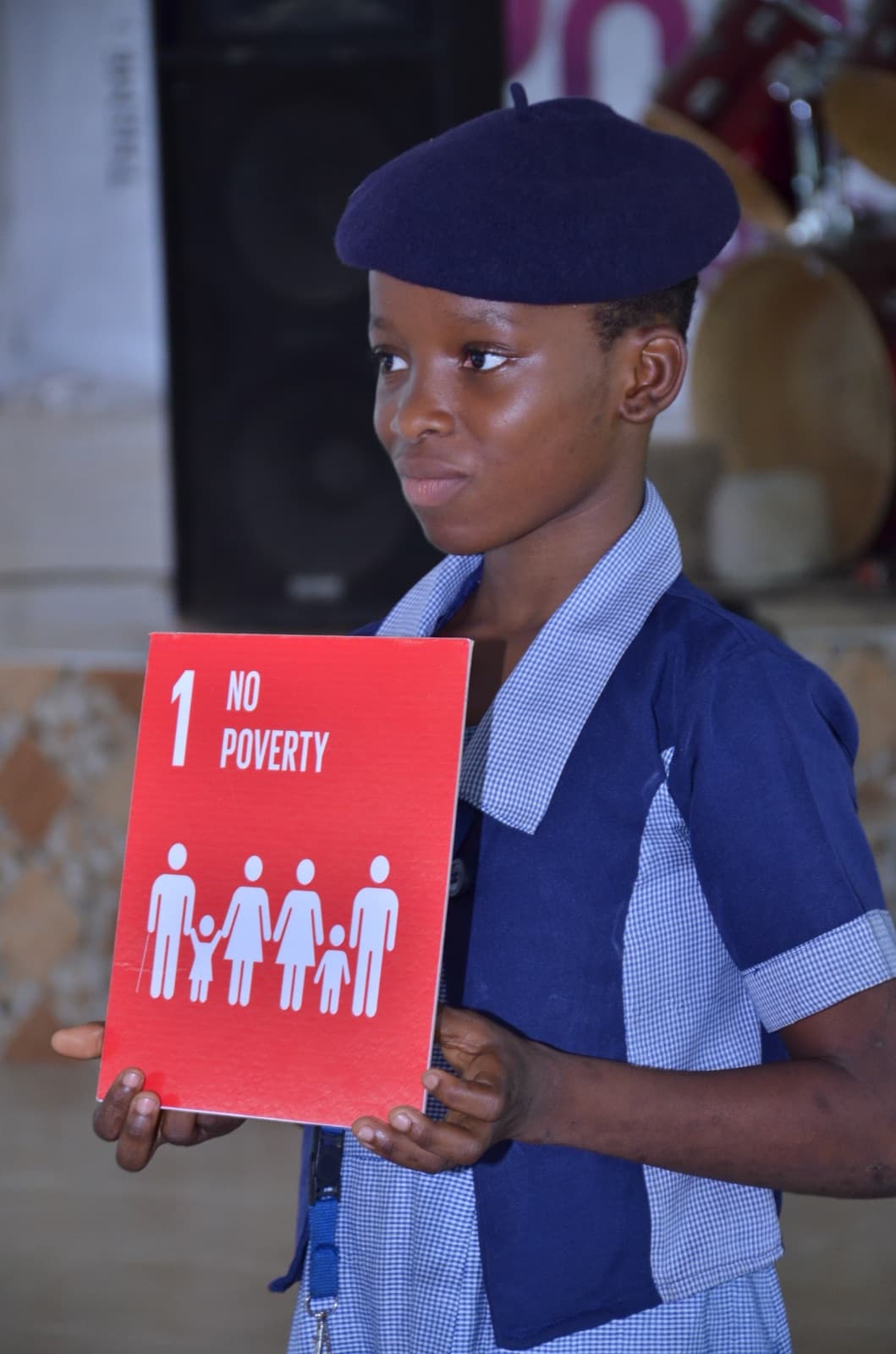 A student holding a Sustainable Development Goals card at Best Legacy International Secondary School, 2019.