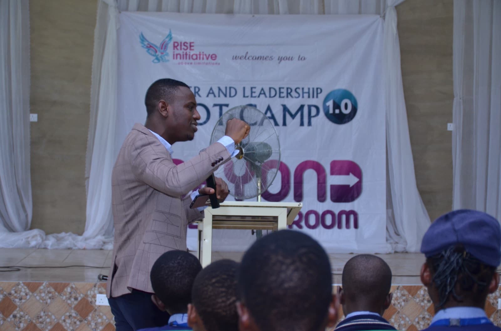 A facilitator leading a session at Best Legacy International Secondary School, 2019.